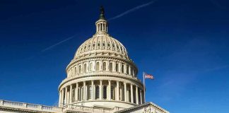 United States Capitol dome against clear blue sky
