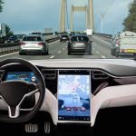 Cameras Put In Every Car – Coming Soon! Self-driving car interior on a busy bridge highway