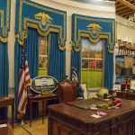Oval Office-style desk and decor in a museum display