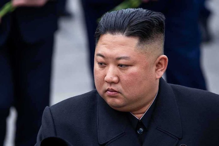 Kim Jong-Un looking to the side in a dark overcoat