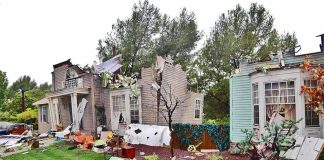 Bodyguard Rampages Senator’s Home Houses with significant storm damage and debris scattered around the yard