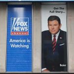 Tucker Carlson and Bret Baier on large Fox News promotional posters