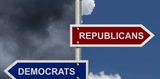 Blue City Mayor Becomes Republican During RNC Directional signs for two political parties on a pole
