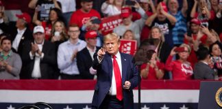 Moment Trump Closes Out GOP Convention Will Have Libs Melting Down man in suit points from a stage at a political rally