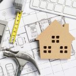 STIFFED BY OBAMA: Subcontractor Forced to Shut Down House model on architectural blueprints with tools and keyboard
