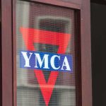 Trump’s FAVORITE Musician Dies Aged 74 YMCA logo on a glass door