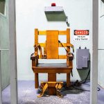 Supreme Court Stuns State – Execution Halted! electric chair in a prison execution chamber