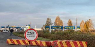 Zelenskyy Drops Bombshell At UN Ukraine border crossing with stop sign and barrier