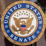 Fetterman’s Ultimatum Shakes Democrats United States Senate seal at a podium