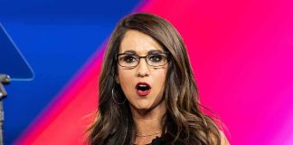 ‘I’m Not a Lesbian’: Boebert Blasts Ethics Complaint Claim Woman with glasses speaking on stage with colorful backdrop
