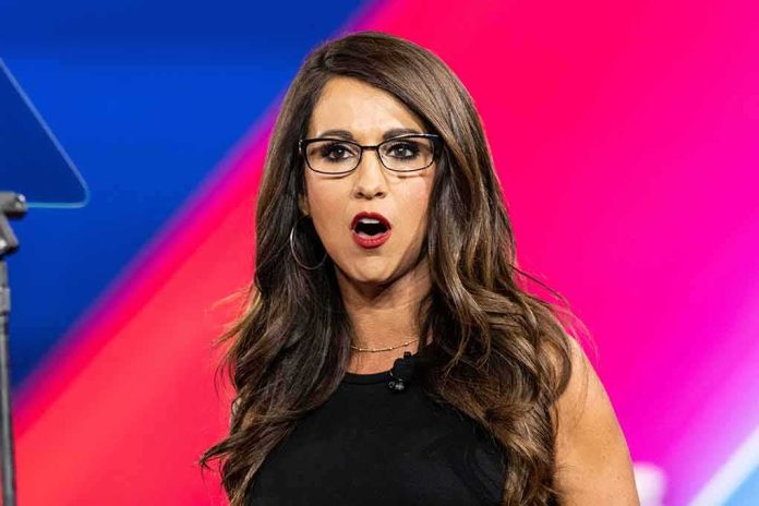 shutterstock_2187507805 Woman with glasses speaking on stage with colorful backdrop