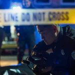 National Guard KILLS Civilian – Family Demands Justice! Police officer examines evidence at night behind caution tape