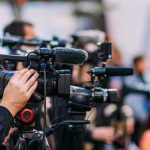 Trump’s Midnight Slam: RINO’s Career ‘OVER!’ Video cameras on tripods at a media event