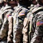 Soldiers in camouflage uniforms standing in formation