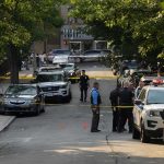 Hate Crime Rush: Evidence Hidden in Mosque Attack Police officers secure a residential street with patrol cars and yellow tape