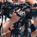 NYC Burns As Celebration Spiral Out Of Control! television cameras on tripods at a media event