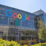 Google Engineer’s CAUGHT – Shocking Inside Trading Racket! Google headquarters glass building exterior on a sunny day