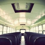 Several DEAD After Train Hits School Bus! Empty school bus interior with rows of seats