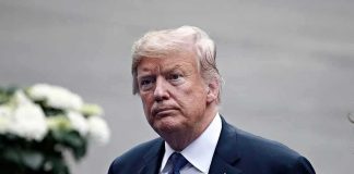 Trump Demands Death Row For Firefighter Killers man in a suit with an American flag pin