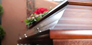 Wooden casket with floral arrangement