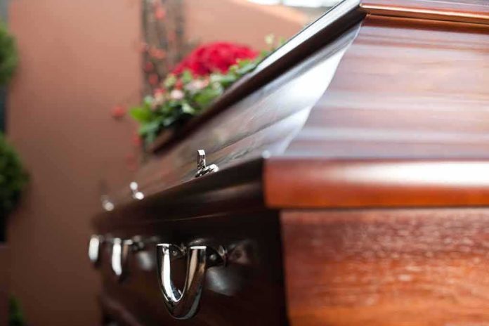 Wooden casket with floral arrangement