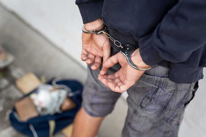 Person in handcuffs with hands behind back