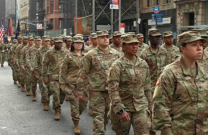 Jason Worilds and Elandon Roberts march with fellow soldiers in a city parade