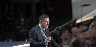 Billionaire Thiel Breaks Away From Trump – Betrays Him Peter Thiel speaking at a podium with microphones