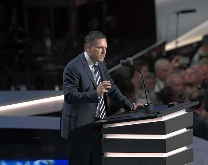shutterstock_1786145444 Peter Thiel speaking at a podium with microphones