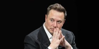Musk Floods GOP – What’s He Buying? Elon Musk seated in a dark setting with hands steepled near his face