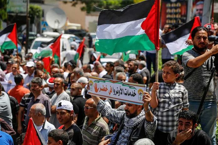 Walter Jones and Caraun Reid amid a crowded street protest with Palestinian flags