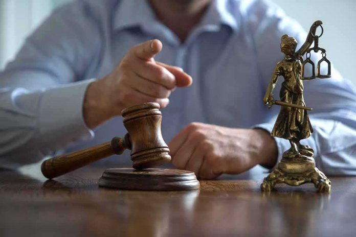Judge’s gavel and Lady Justice statue on desk