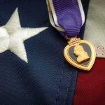 Purple Heart medal on an American flag