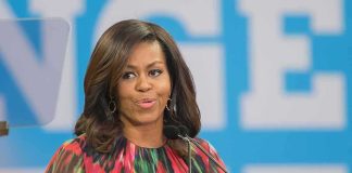 Michelle Obama speaking at a podium with a microphone