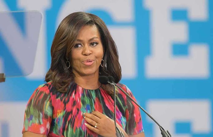 Michelle Obama speaking at a podium with a microphone