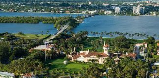 Trump UPGRADES Mar-a-Lago With Missile Launchers Aerial view of a waterfront estate with pool, lawns, and palm trees