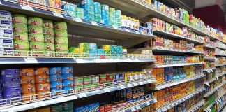 grocery store aisle with shelves of canned goods