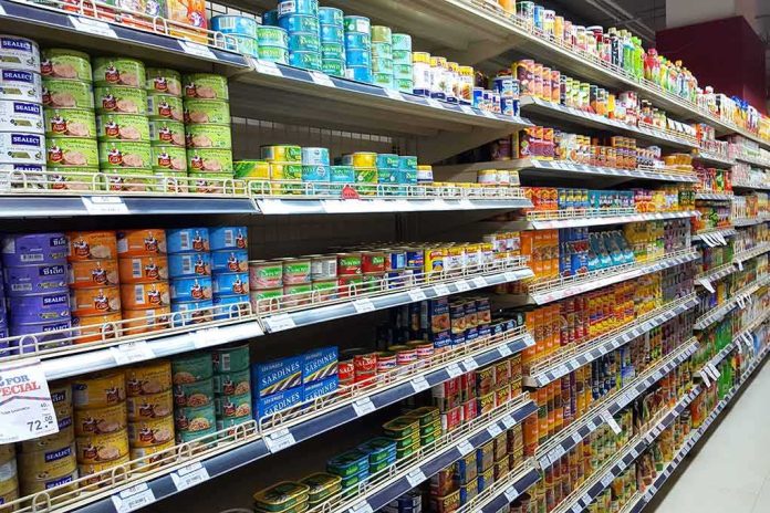 shutterstock_611109848 grocery store aisle with shelves of canned goods