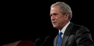 Bush Family Member BETRAYS GOP, Votes Blue George W. Bush speaking at a podium with microphones